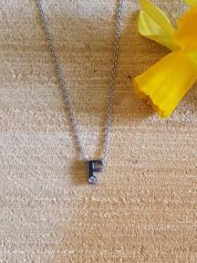 initials letter F met Zirkonia Joy de la Luz