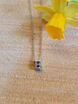 initials letter B met Zirkonia Joy de la Luz